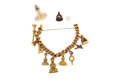 Lot 10 - A charm bracelet with assorted intaglio fob...