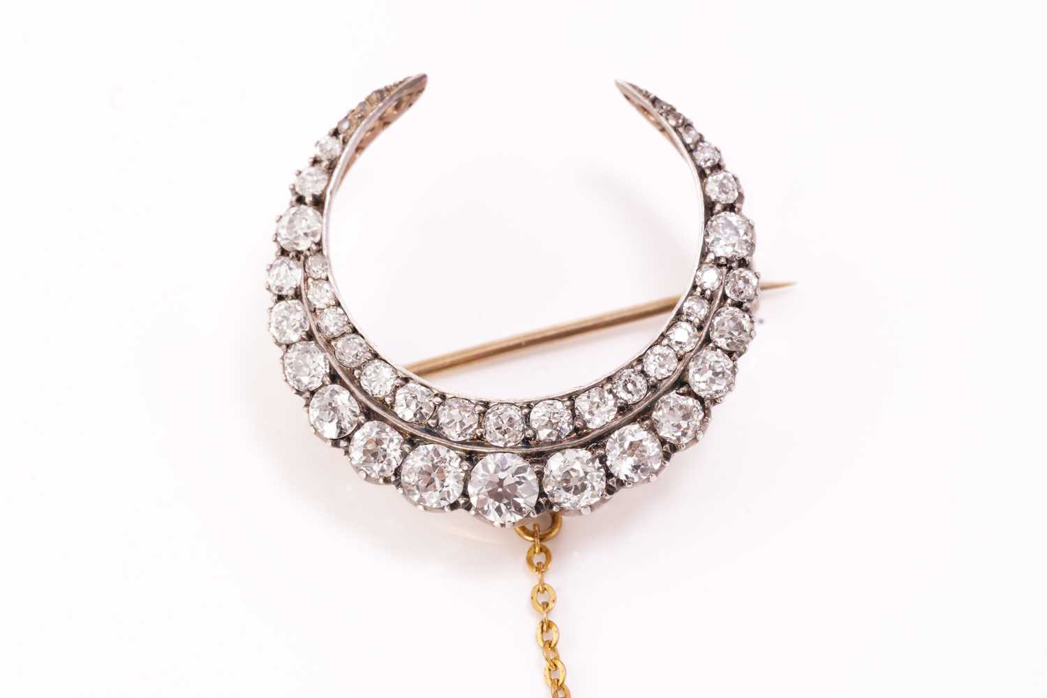 Lot 42 - A Victorian diamond crescent brooch, fully...