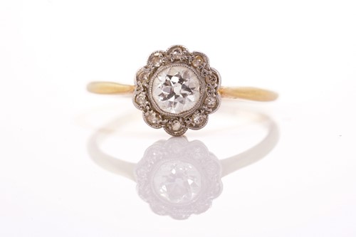 Lot 237 - A diamond daisy head cluster ring, comprising...