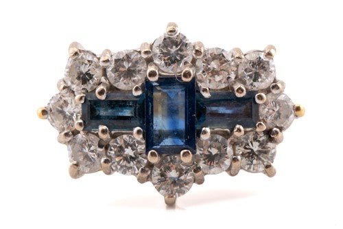Lot 100 - A sapphire and diamond cluster ring in 18ct...