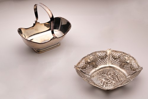 Lot 423 - An early twentieth century fruit basket by M.H....