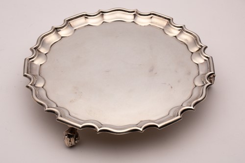 Lot 455 - A salver; circular with raised pie crust...
