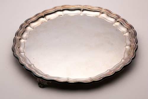 Lot 436 - An Edwardian salver, shaped circular with...