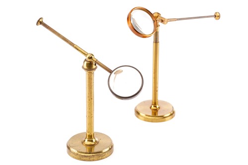 Lot 359 - Two lacquered brass bullseye condenser lenses,...