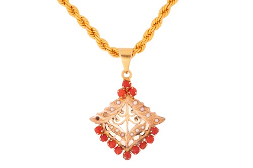 Lot 233 - A precious coral and seed pearl pendant on a...
