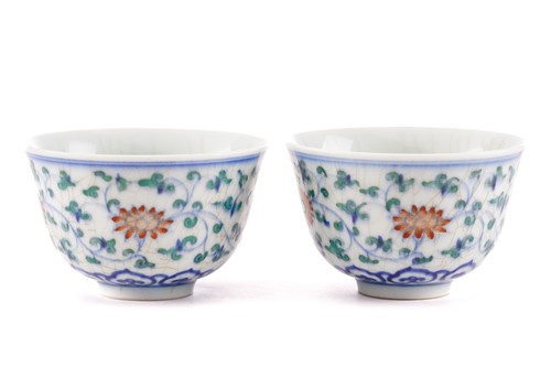 Lot 153 - A pair of Chinese Wucai tea bowls, painted...