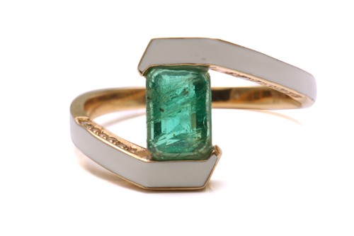 Lot 26 - An emerald and enamel bypass ring, consisting...