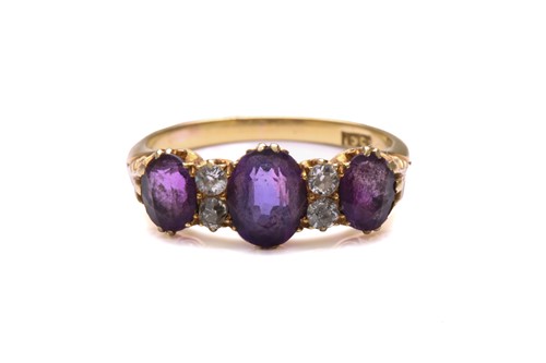 Lot 175 - An amethyst and diamond half hoop ring,...