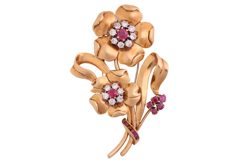 Lot 203 - A brooch set with diamonds and rubies, in form...