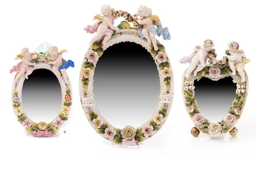 Lot 449 - A Dresden style floral encrusted wall mirror,...