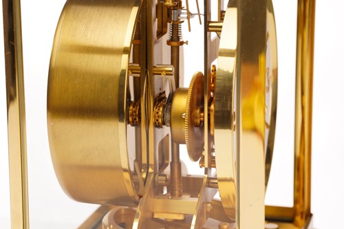 Lot 300 - A Jaeger LeCoultre brushed brass Atmos clock,...