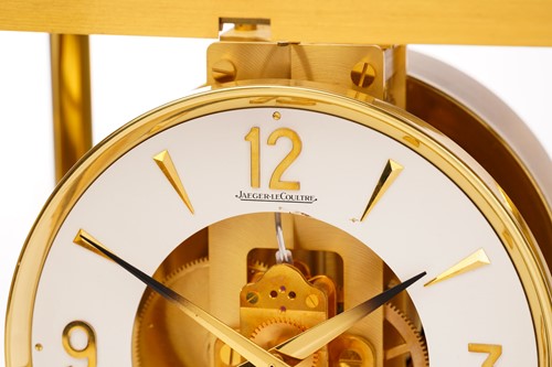 Lot 300 - A Jaeger LeCoultre brushed brass Atmos clock,...