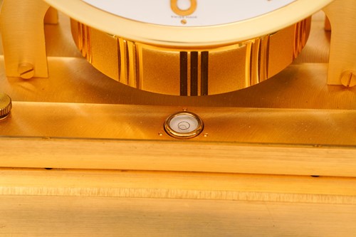 Lot 300 - A Jaeger LeCoultre brushed brass Atmos clock,...