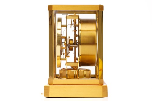 Lot 300 - A Jaeger LeCoultre brushed brass Atmos clock,...