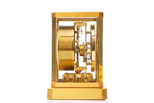Lot 300 - A Jaeger LeCoultre brushed brass Atmos clock,...