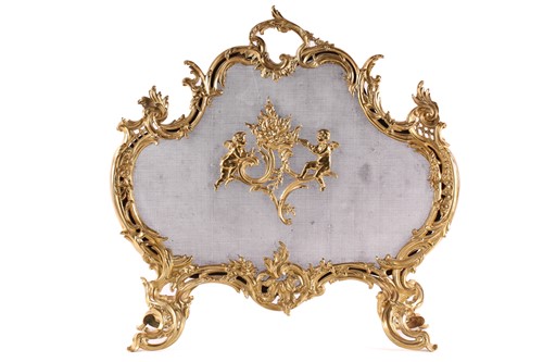 Lot 273 - A Louis XV style gilt metal firescreen, of...