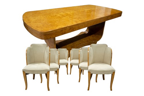 Lot 275 - An Art Deco burr maple dining table and six...