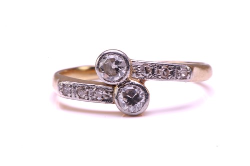 Lot 50 - A diamond Toi et Moi bypass ring,...
