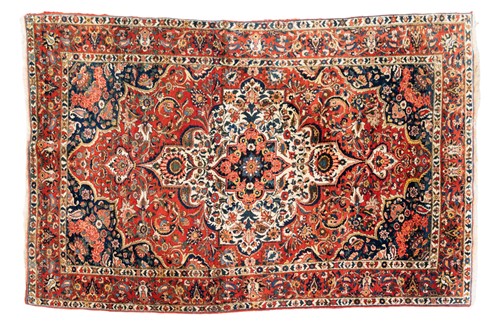 Lot 302 - A red ground Bidjar carpet with book cover...