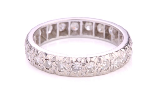 Lot 156 - A diamond eternity ring in platinum,...