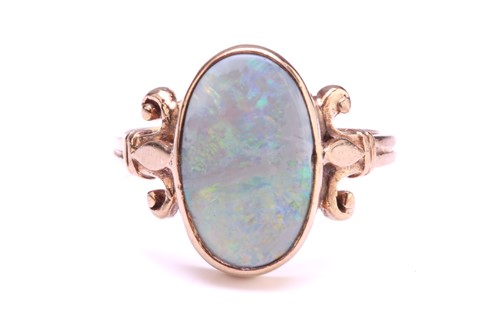 Lot 219 - A precious opal dress ring in 9ct gold,...