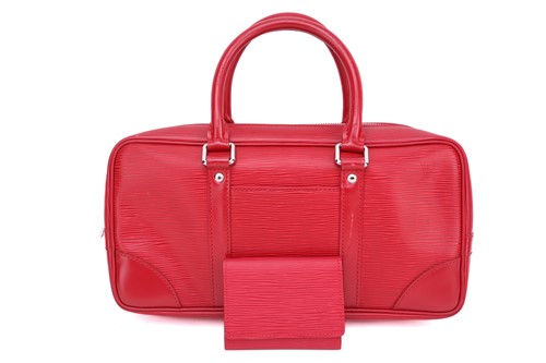 Lot 353 - A Louis Vuitton red epi-leather handbag with...