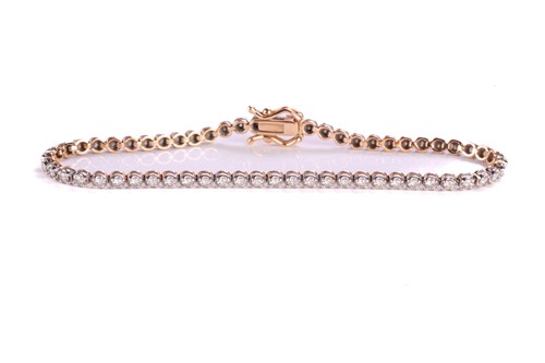 Lot 127 - A diamond line bracelet, comprising an array...