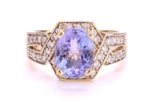 Lot 116 - A tanzanite and diamond dress ring, centrally...