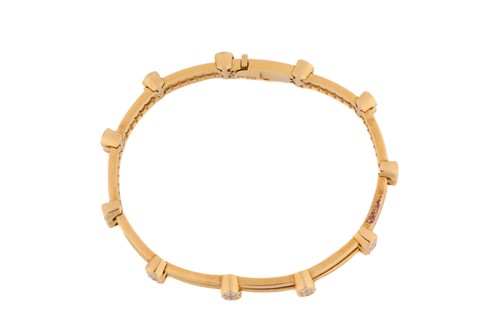 Lot 51 - A diamond-set bracelet, comprising two cords...