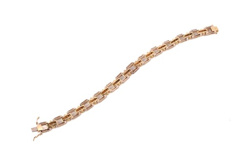 Lot 74 - A bi-coloured, diamond set, open link bracelet;...