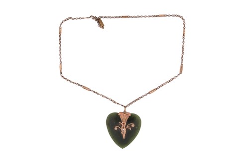 Lot 64 - A Nephrite heart shape pendant measuring...