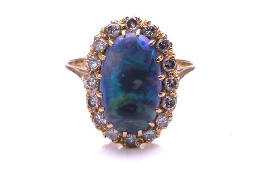 Lot 165 - A black opal and diamond ring, the oval...