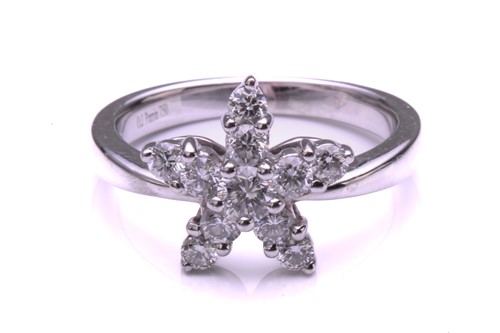 Lot 99 - A French diamond cluster ring, composed of a...