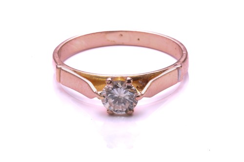 Lot 214 - A diamond solitaire ring, with a central round...