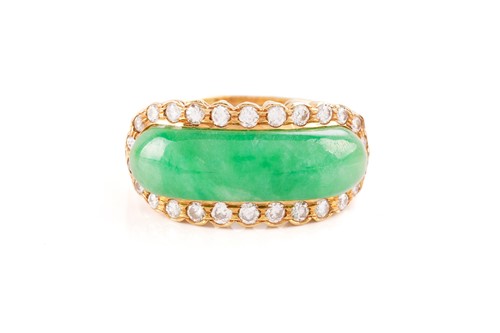 Lot 55 - A Chinese saddle ring set with jadeite and...