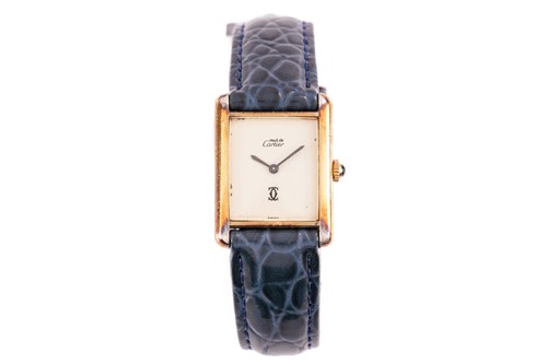 Lot 471 - A Must De Cartier Tank watch, featuring a hand-...