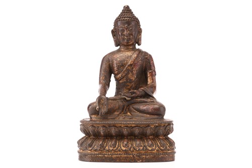 Lot 212 - A patinated and gilt bronze figure of a...