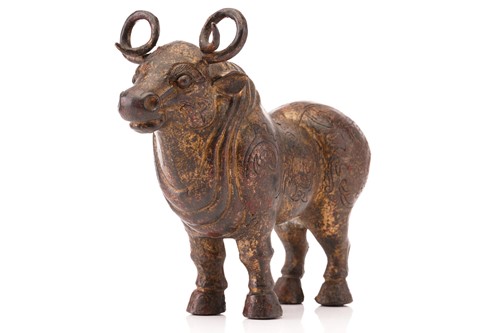 Lot 203 - A Chinese patinated and gilt bronze figure of...