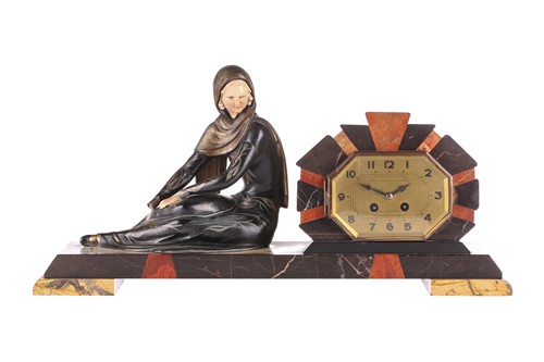 Lot 318 - An Art Deco patinated spelter and ivorine...