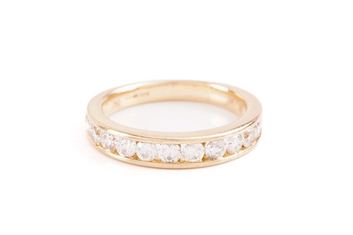 Lot 33 - A diamond half-eternity ring in 18ct yellow...