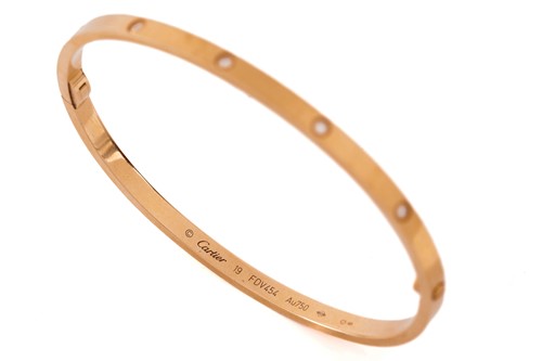 Lot 39 - Cartier - A diamond-set 'LOVE' bangle in 18ct...