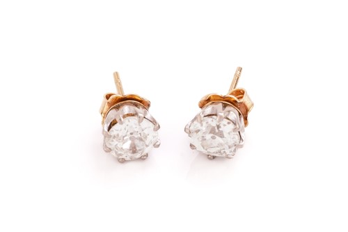 Lot 183 - A pair of diamond solitaire stud earrings,...