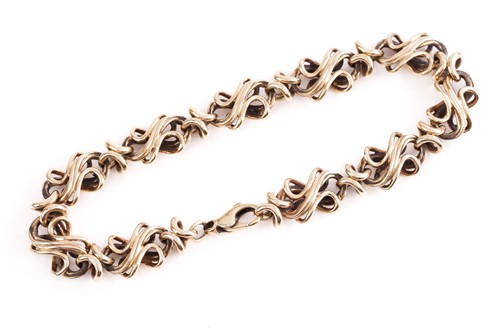 Lot 199 - A yellow metal fancy wirework bracelet; to a...