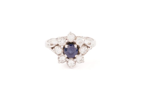 Lot 96 - A sapphire and diamond flowerhead ring,...
