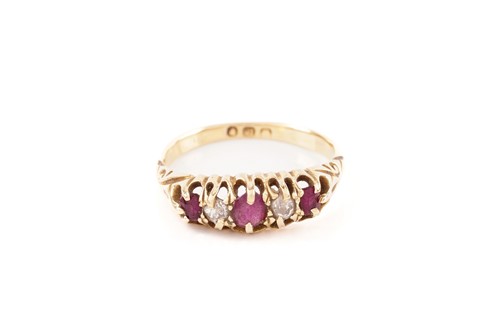 Lot 59 - A five-stone half-hoop ring set with rubies...