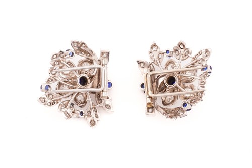Lot 43 - A floral duette brooch set with sapphires and...