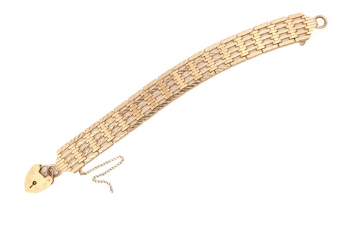 Lot 49 - A 9ct gold gate link bracelet with heart...
