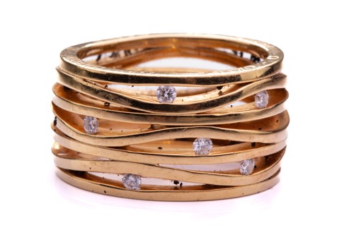 Lot 219 - Omega - A seven-row ring set with diamonds in...