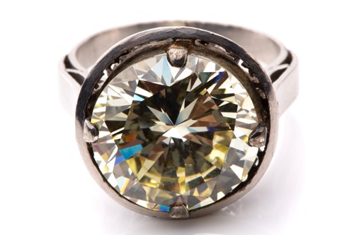 Lot 227 - A diamond solitaire ring, featuring a light...
