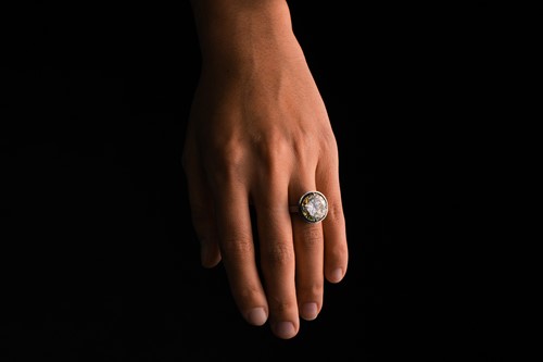 Lot 227 - A diamond solitaire ring, featuring a light...